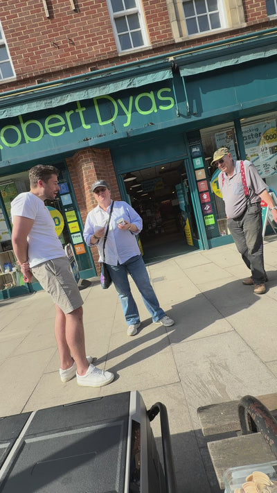 Co-founder, James, on a high street conversing with a couple who have just tried a sample of Honest Scoop ice cream.